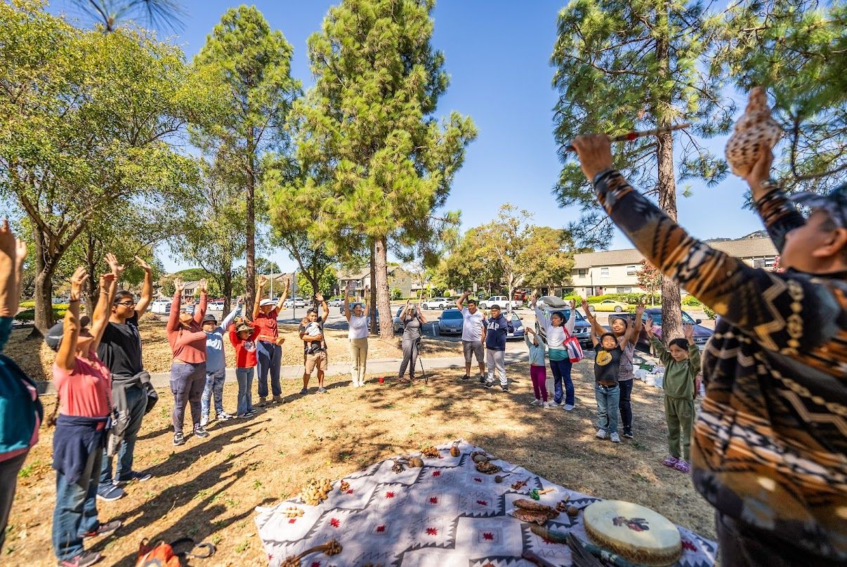 Community members gathered together outdoors